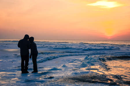 A couple watching the sunsetの写真素材