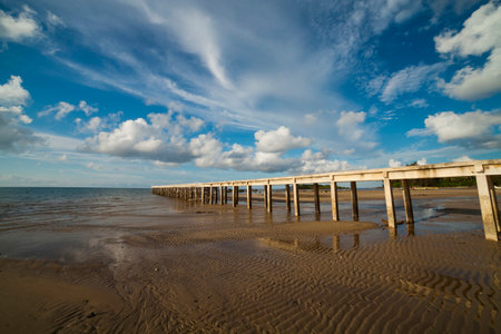 jetty leads out to the sea in daytime, Belitung Indonesiaの写真素材