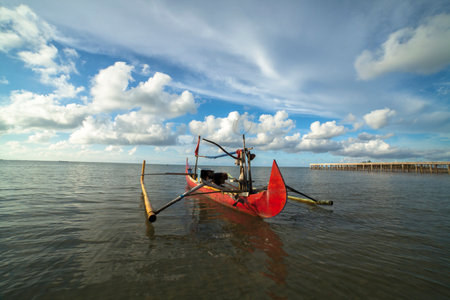 Fishing boats leaning on the beachの写真素材