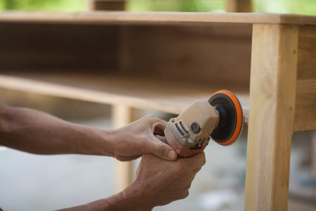 Close up sanding wood with machineの写真素材
