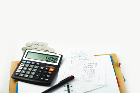 Business desk with calculator, notebook, and bills. Copy space website banner conceptの写真素材