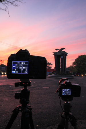 Two cameras take pictures at sunriseの写真素材