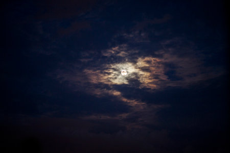 Full moon and black clouds