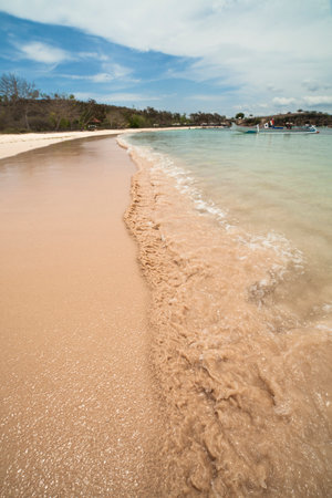 Splasing wave at pink beach Lombok Indonesiaの写真素材