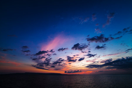 Sunset from tropical beach with purple sky, Lombok Indonesiaの写真素材