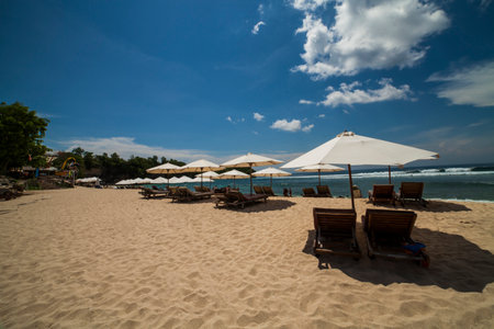 Beach umbrella on a sunny day, sea in background, Bali Indonesiaの写真素材