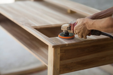 carpenters work smoothing wood with a machineの写真素材