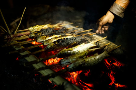 cooking grilled fish with emberの写真素材
