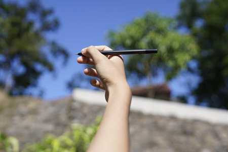 the concept of education by holding a penの写真素材