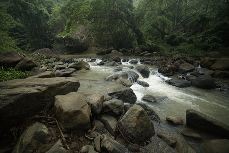 The river is rocky and the water is murkyの写真素材