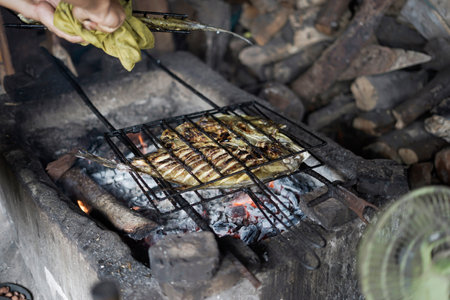 big fish grilled on charcoalの写真素材