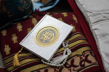 Holy Al Quran with written arabic calligraphy meaning of Al Quran