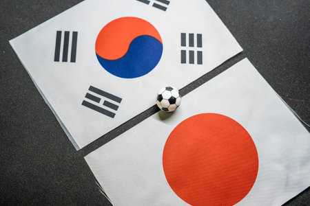 South Korea vs Japan, Football match with national flagsの写真素材
