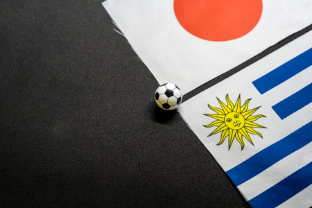 Japan vs Uruguay, Football match with national flags
