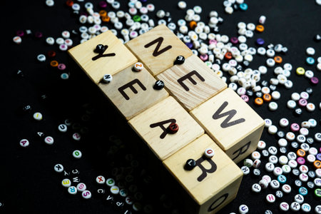 New year resolutions with writing block with a collection of letters in the backgroundの写真素材