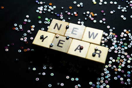 New year resolutions with writing block with a collection of letters in the backgroundの写真素材
