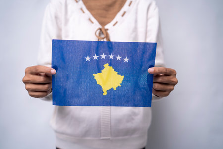 Person Holding the Flag of Kosovo with Prideの写真素材