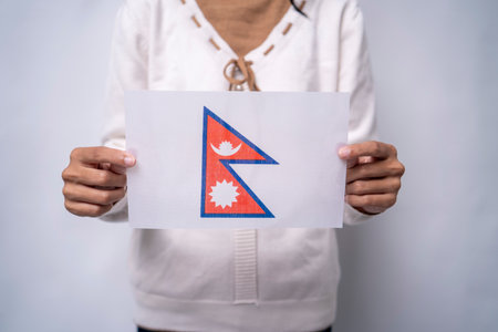 Person Holding the Flag of Nepalの写真素材
