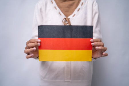 Person Holding the Flag of Germanyの写真素材