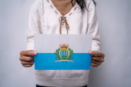 Person Holding the Flag of San Marino with Prideの写真素材