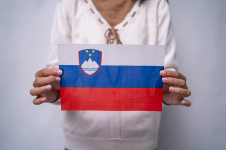 Person Holding the Flag of Slovenia with Prideの写真素材