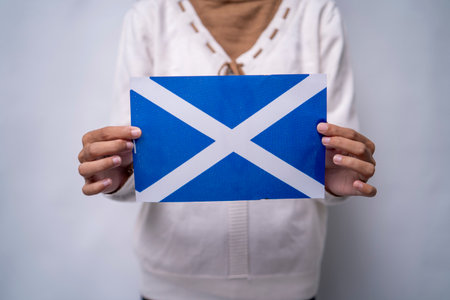 Person Holding the Flag of Scotlandの写真素材