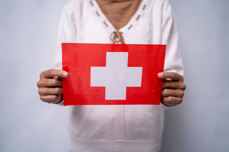 Person Holding the Flag of Switzerlandの写真素材