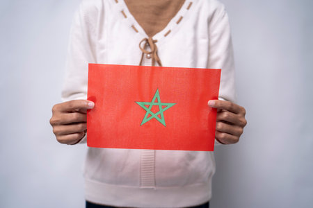 A person holding the flag of Morocco with prideの写真素材