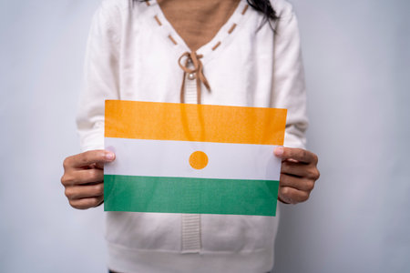 Hands Holding the Proud National Flag of Nigerの写真素材
