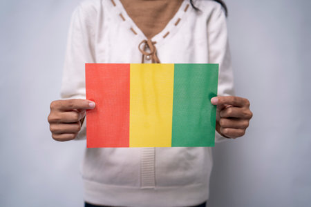 Hands Holding Mali Flag Symbol Of National Unityの写真素材