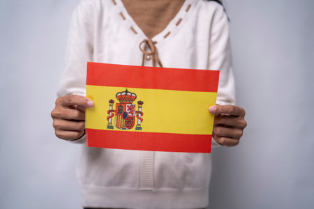 Hands Holding Spain Flag Symbol Of National Prideの写真素材