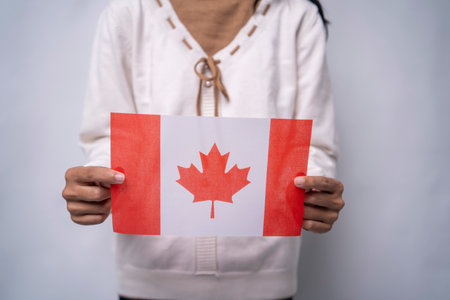 Hands Holding Canada Flag Symbol Of National Prideの写真素材