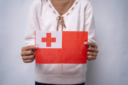 Hands Holding National Flag of Tongaの写真素材