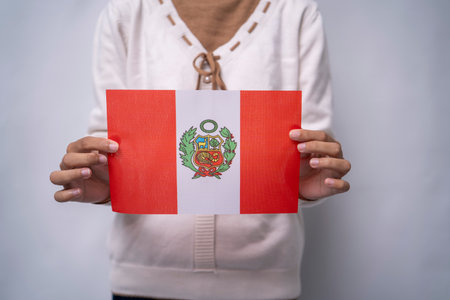 Hands Holding Flag of the Nation Peruの写真素材