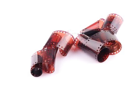 Old camera film strip over a white backgroundの写真素材