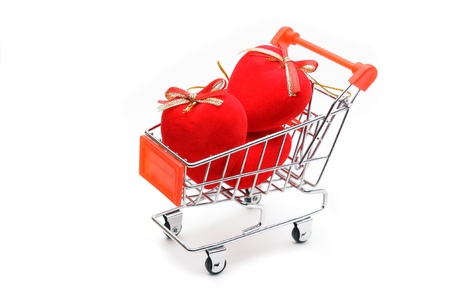 Hearts in shopping cart isolated on white backgroundの写真素材