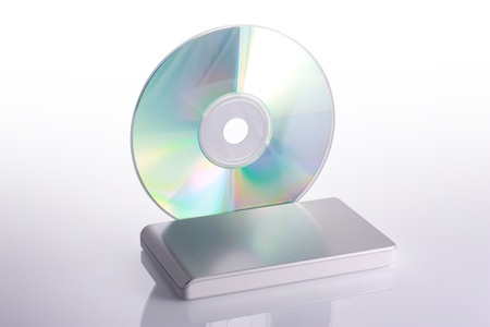 External hard disk and blank dvd on white background with reflection  Including clipping path の写真素材