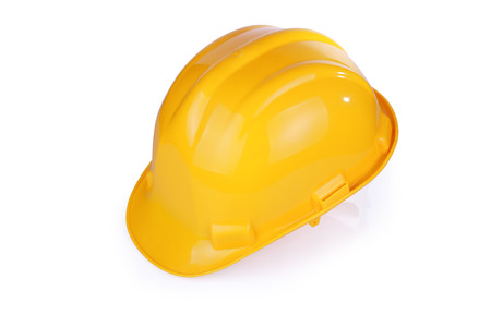 Yellow hardhat isolated on white background with clipping pathの写真素材