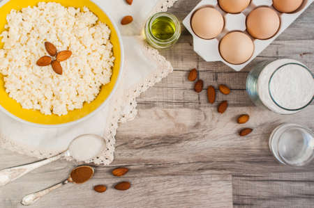 Baking Ingredients. Ingredients for baking. Cottage cheese, vegetable oil, eggs, flour, almonds,...