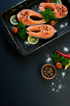 Ingredients for cooking: vegetables, spice, lemon and olive oil. Rustic style. Top view. Selective focusの写真素材