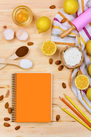 Basic baking ingredients and kitchen tools close up. Cooking concept composition on wooden table. Top view. Selective focusの写真素材