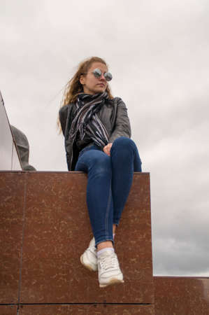 Yong beautiful white girl in urban background monochromeの写真素材