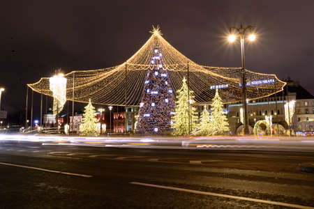 Russia, Moscow, January 07, 2020: Lubyanka Square, a Christmas tree in the center decorated with lights, a night festive cityのeditorial素材