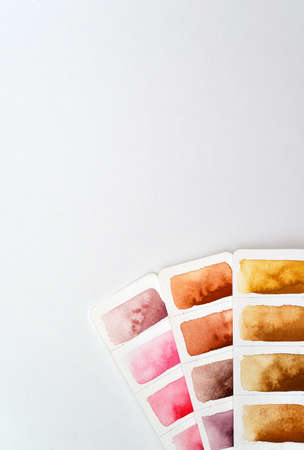 Color palette, three strips of paper with brown and pink shades, watercolor paper. For color...