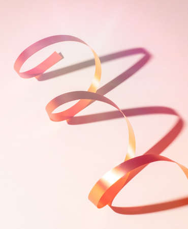 Spiral ribbon on white background with shadowの写真素材