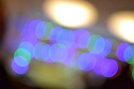 Blurred Christmas lights indoors