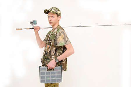 Angry teenager ready for fishing isolated on white background