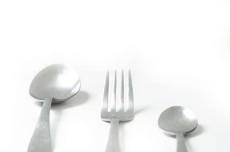 Stainless steel silver Spoon, Fork and small Spoon isolated on whiteの写真素材