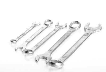 5 Wrench of different sizes aligned from smallest to biggest isolated on white backgroundの写真素材