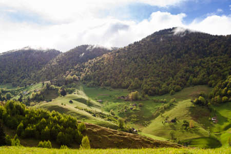 Mountain landscape with small wood houses cabinsの写真素材